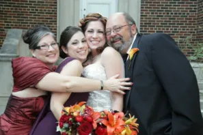 A bride and her family posing for a picture.