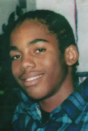 A young man smiling for the camera.