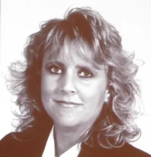 A black and white photo of a woman with long hair.