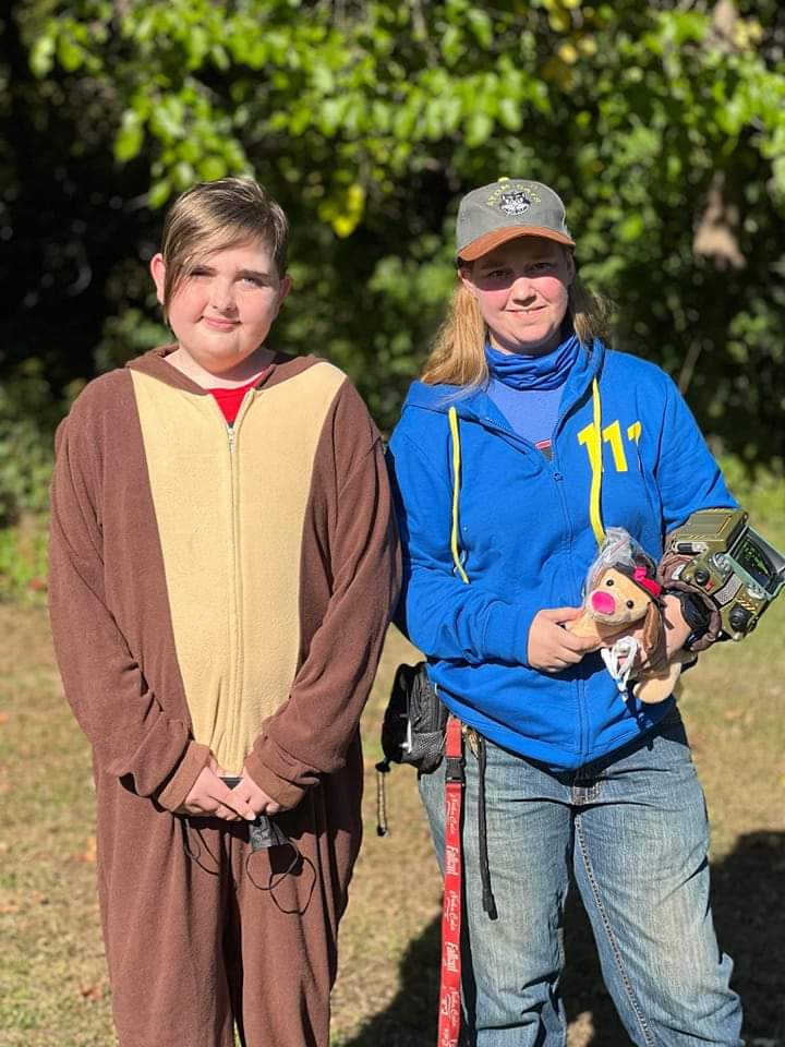 Two people in costumes standing next to each other.