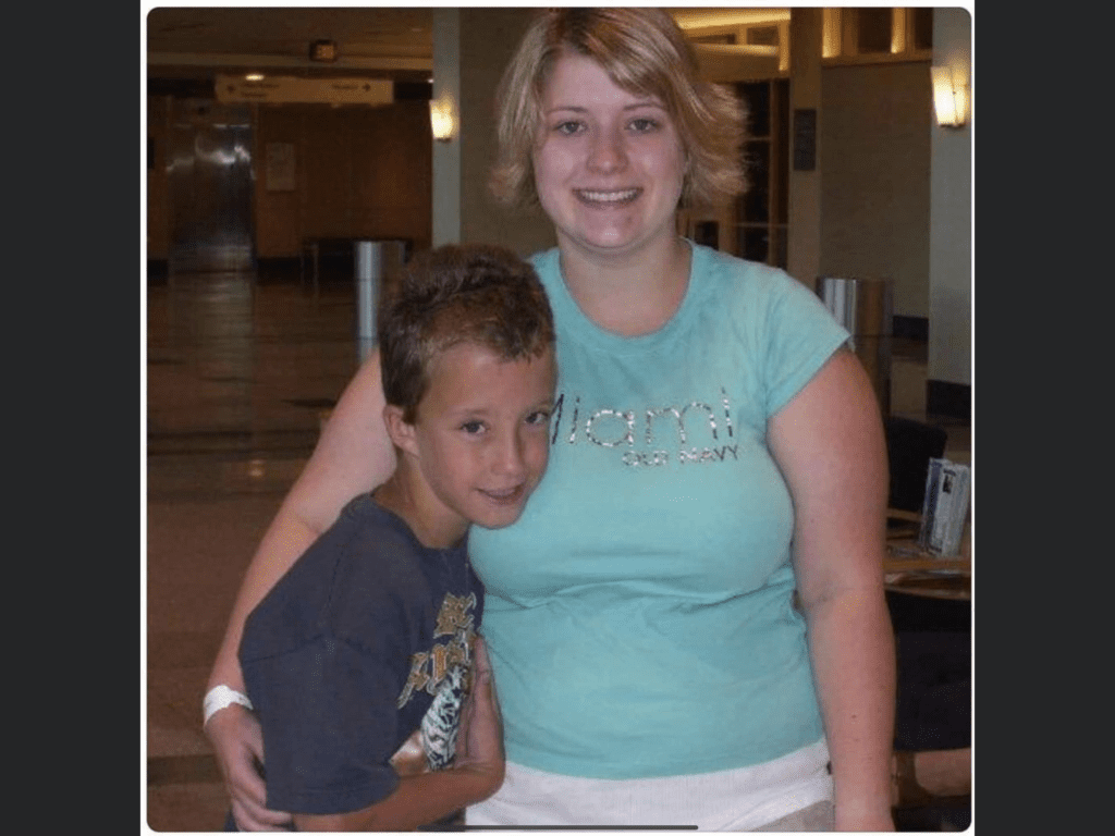 A woman and boy posing for the camera.