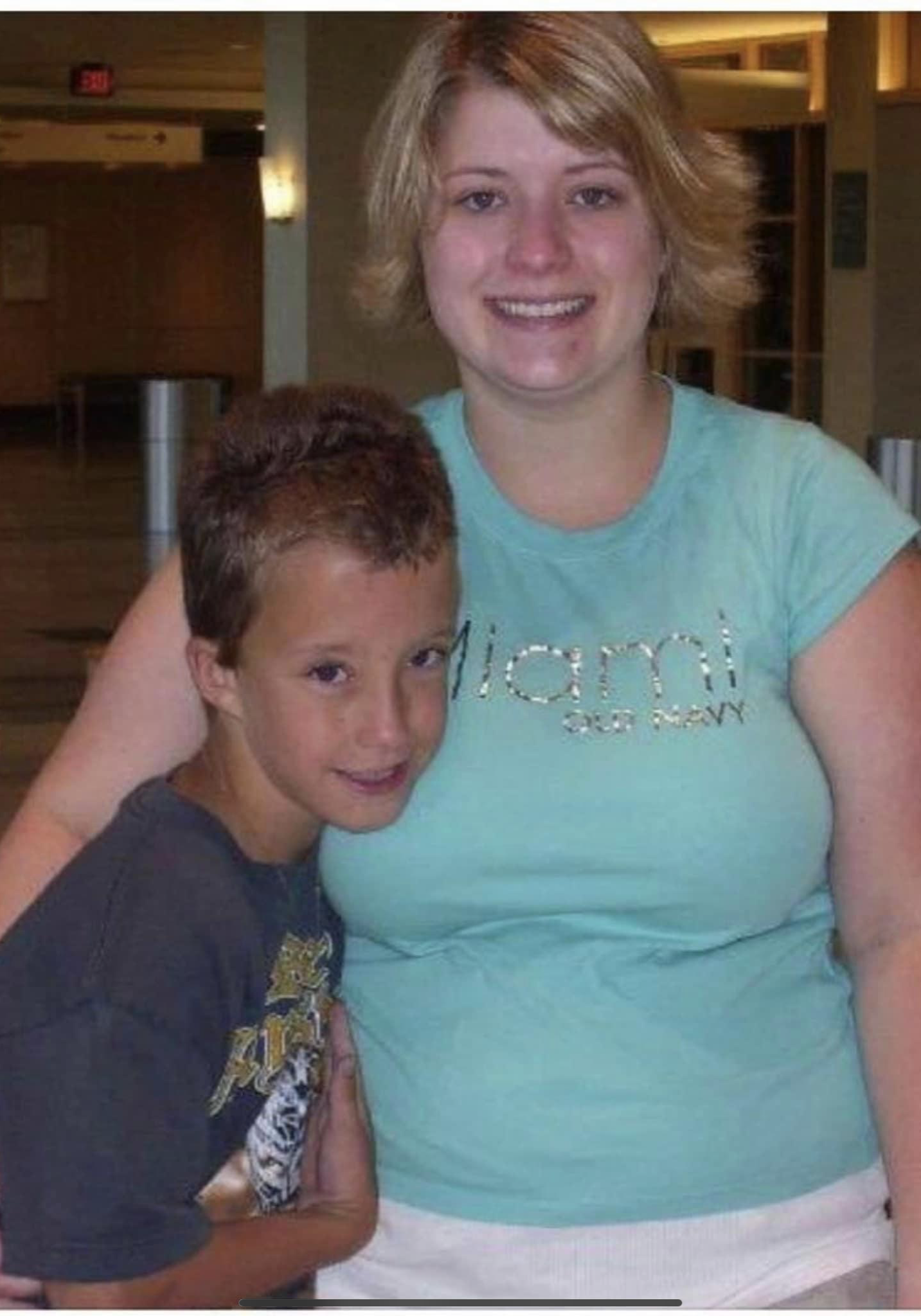 A woman and boy posing for the camera.