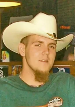 Chase Christopher Swonke A man with a beard and white cowboy hat.