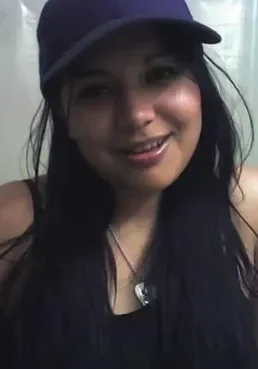 Courtney Jo Sister A woman wearing a hat and smiling for the camera.