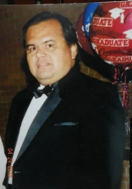 A man in a tuxedo and bow tie.