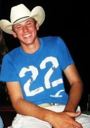 Dustin Thomas Sandefur A man wearing a cowboy hat and smiling.