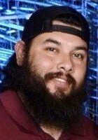 A man with a beard wearing a hat.