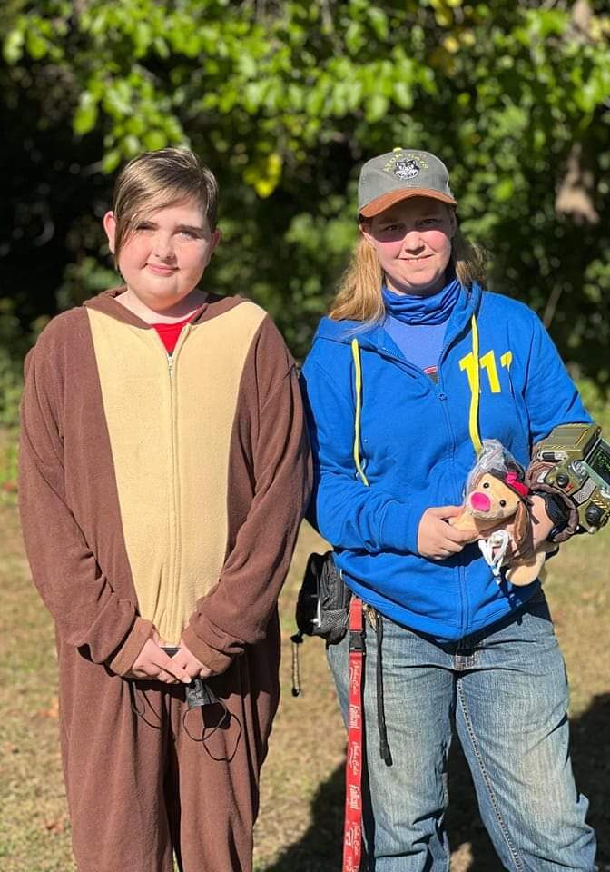 Two people in costumes standing next to each other.